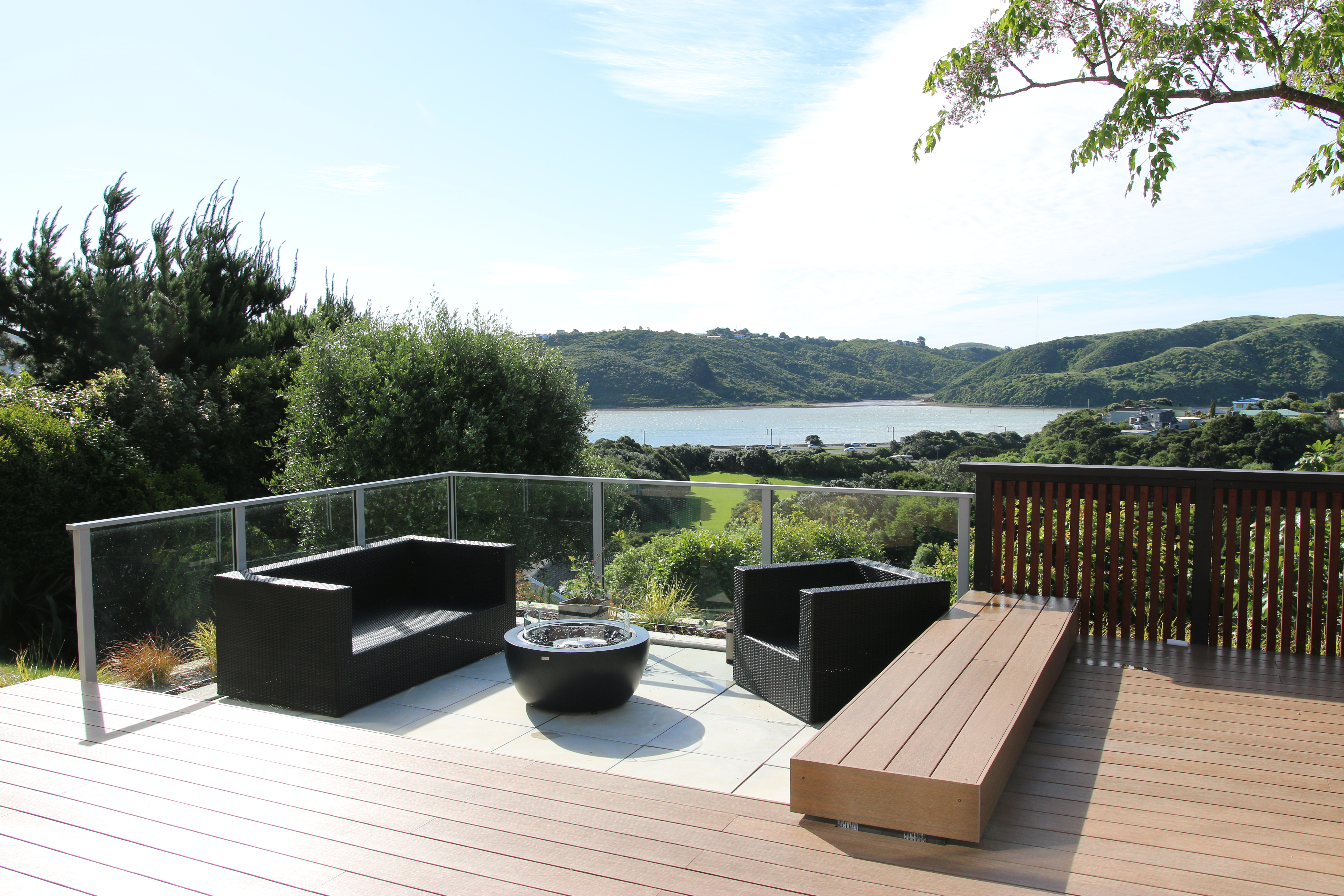 Outdoor patio area with wooden deck