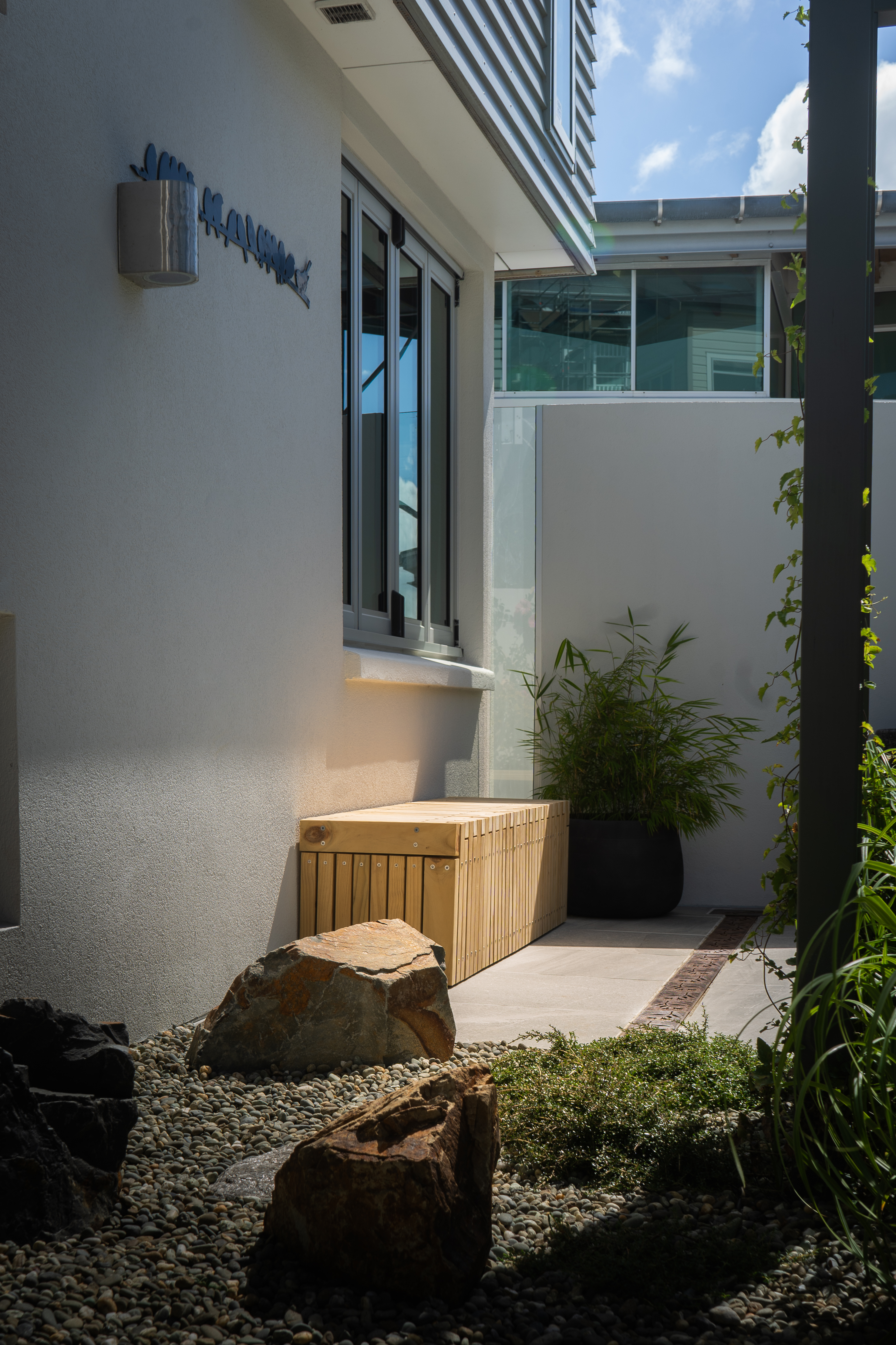 Courtyard pathway leading to the main entrance.