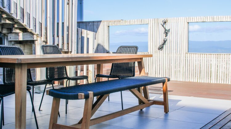 Custom pergola with integrated lighting system at dusk.