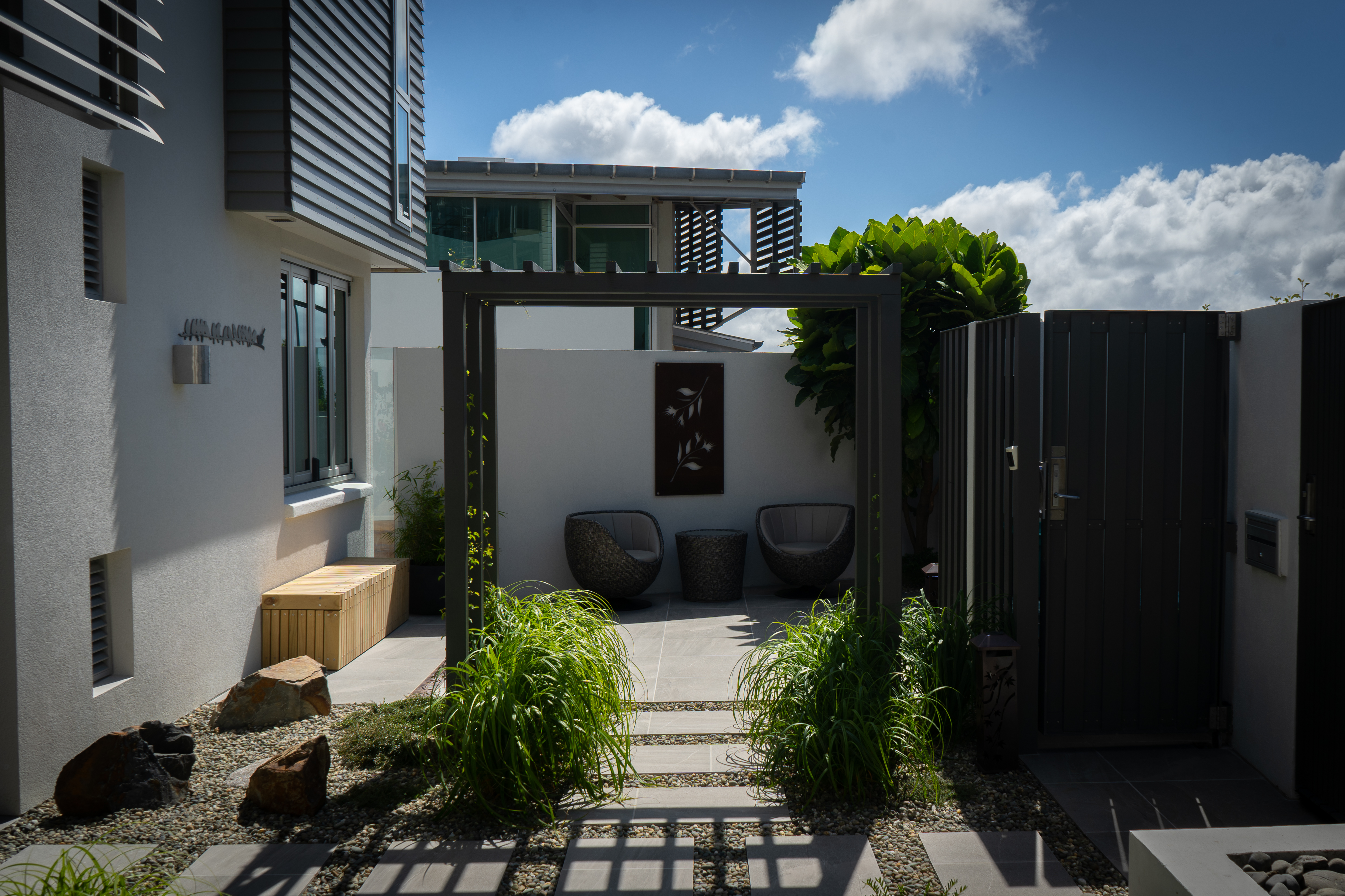 Outdoor patio with wooden decking and pizza oven