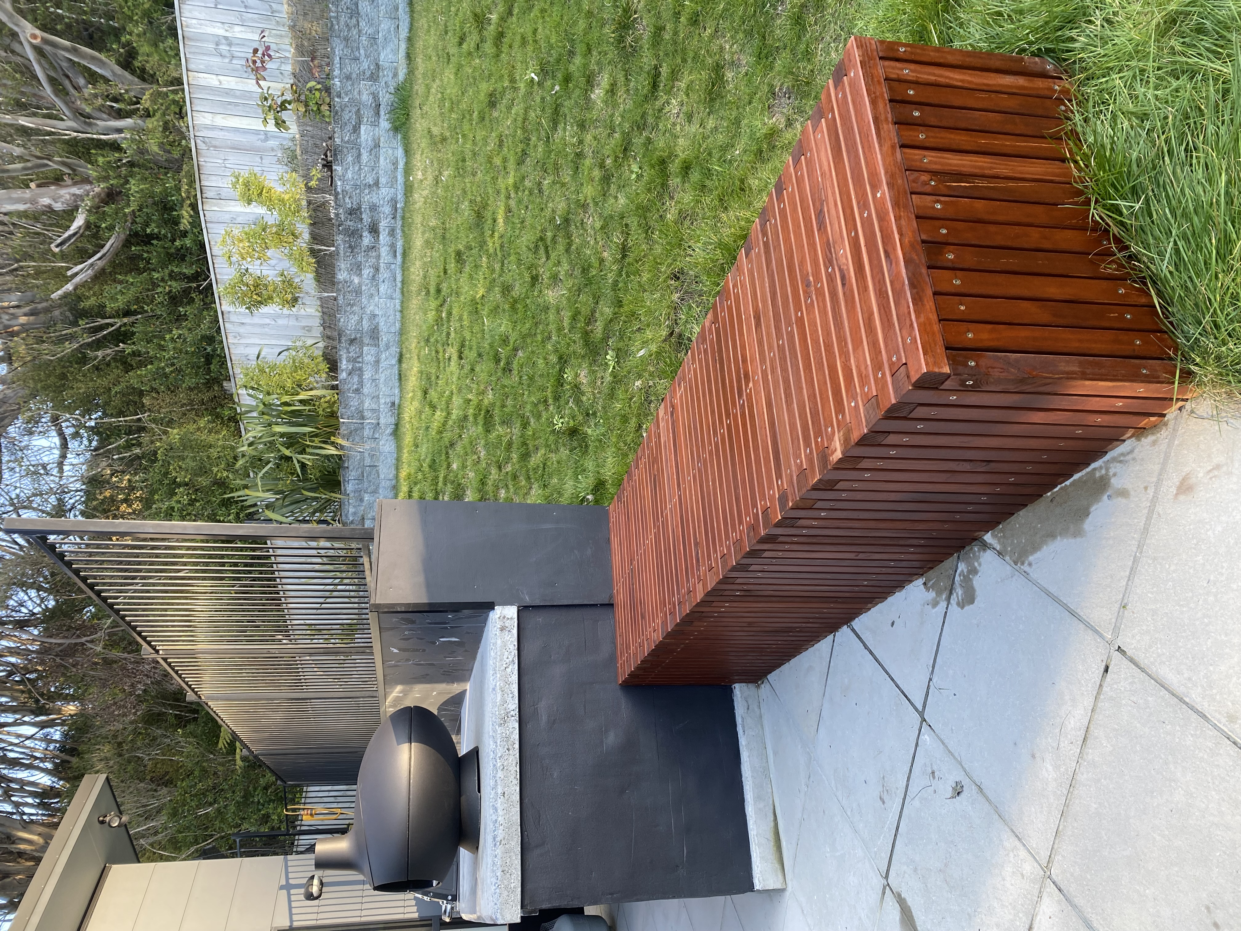 Night view of the outdoor area with integrated lighting creating a warm ambience