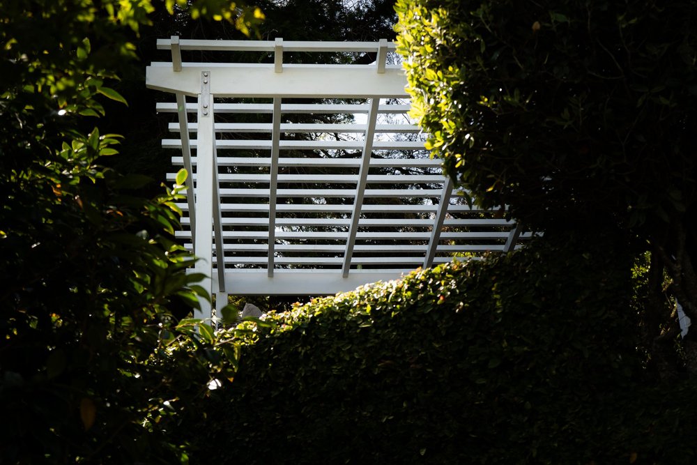A modern tiered garden with wooden planters.