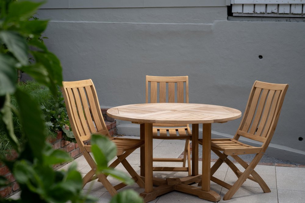 Wide view of a modern paved courtyard with seating